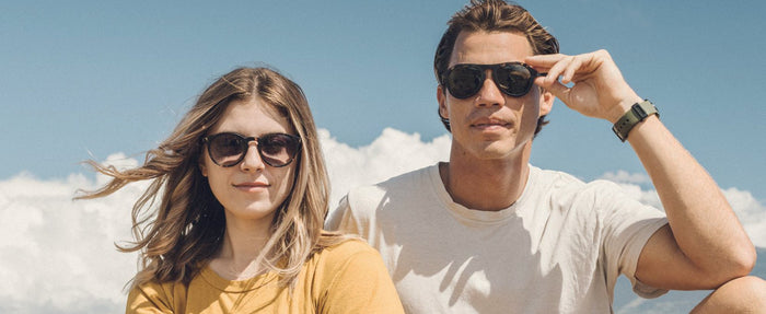 Man and woman wearing Sunski polarized sunglasses.