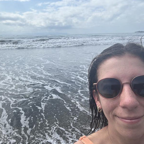 woman in front of waves in baia