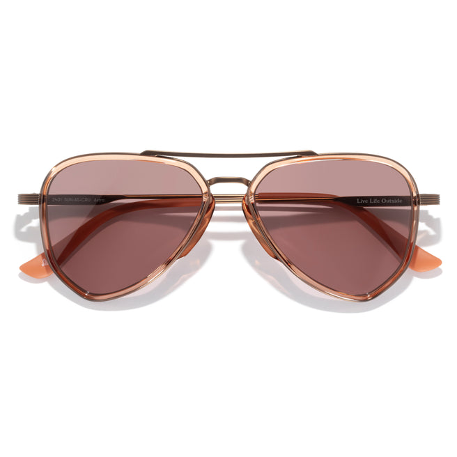 Sunglasses with brown lenses and gold frame on a white background