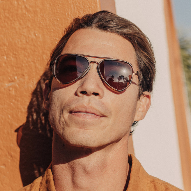 Man wearing sunglasses with a warm-toned filter