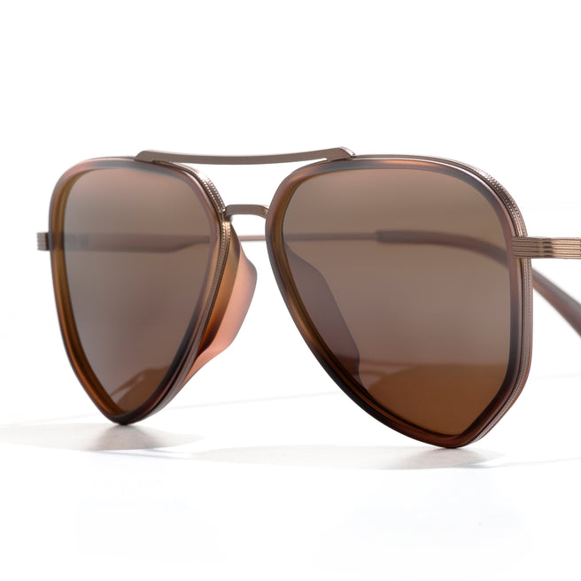 Brown sunglasses with a reflective lens on a white background