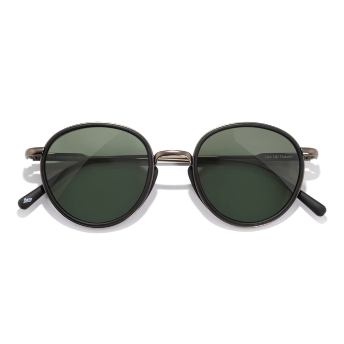 Baia - Black Forest - Round sunglasses with dark lenses on a white background