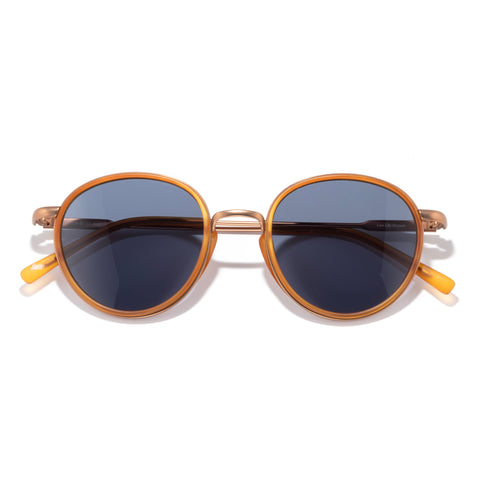 Baia - Tangerine Midnight - Round sunglasses with gold frame and dark lenses on a white background