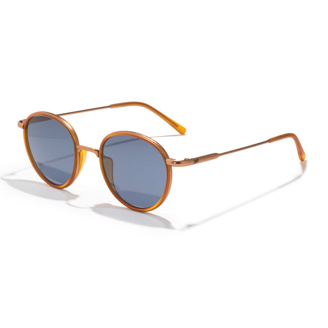 Round sunglasses with gold frame and blue lenses on a white background