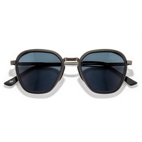 Bernina - Black Slate - Sunglasses with dark lenses and gold frame on a white background