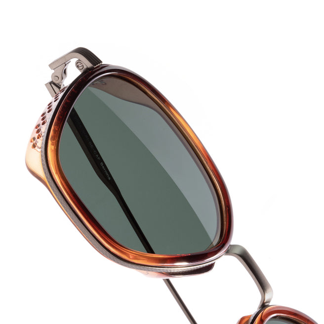 Sunglasses with a brown frame and dark lenses on a white background
