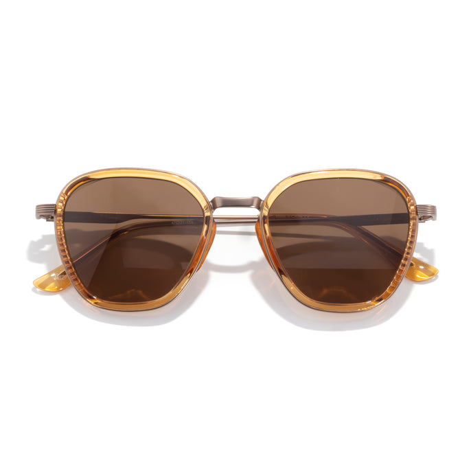 Bernina - Desert Amber - Gold-framed sunglasses with brown lenses on a white background