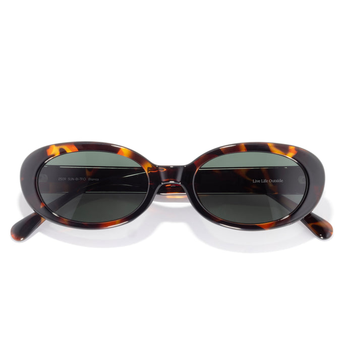 Bianca - Tortoise Forest - Sunglasses with tortoiseshell frame and dark lenses on a white background