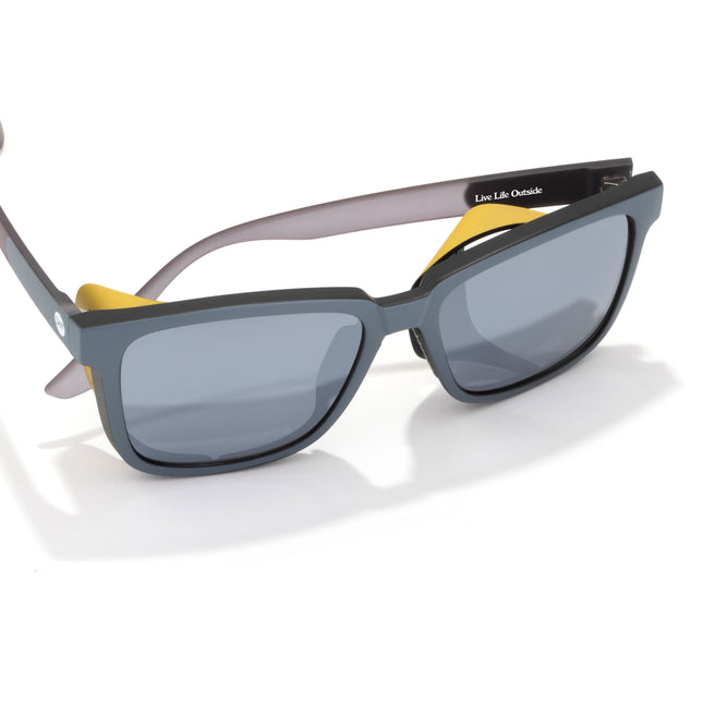 Sunglasses with a yellow case on a white background