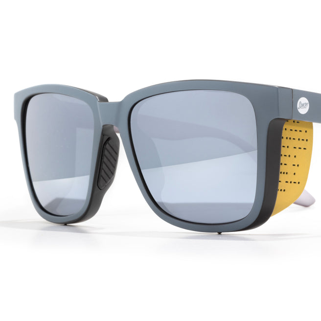 Sunglasses with a yellow strap on a white background