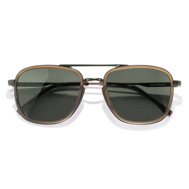 Sunglasses with gold frame and dark lenses on a white background