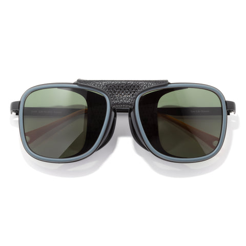 Ferrata - Storm Forest - Sunglasses with dark lenses and textured black frame on a white background