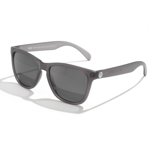 Sunglasses with tortoiseshell frame and dark lenses on a white background