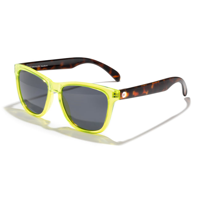 Sunglasses with yellow frame and tortoiseshell arms on a white background