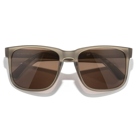 Kiva - Cola Amber - Sunglasses with brown lenses and a beige frame on a white background