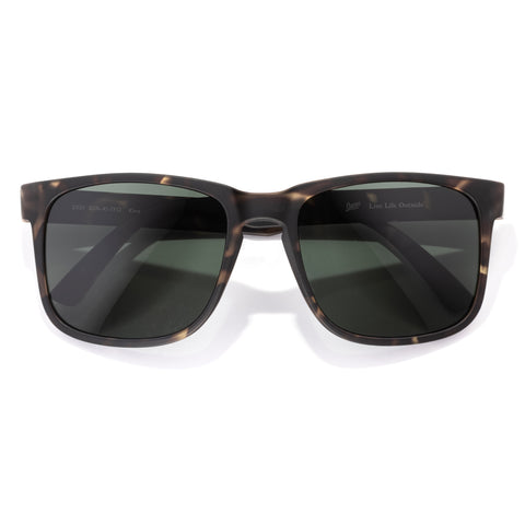 Kiva - Tortoise Forest - Sunglasses with tortoiseshell frame and dark lenses on a white background