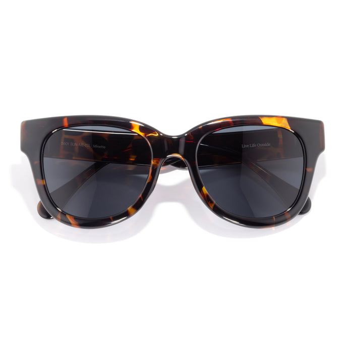 Minette - Tortoise Slate - Sunglasses with tortoiseshell frame and dark lenses on a white background