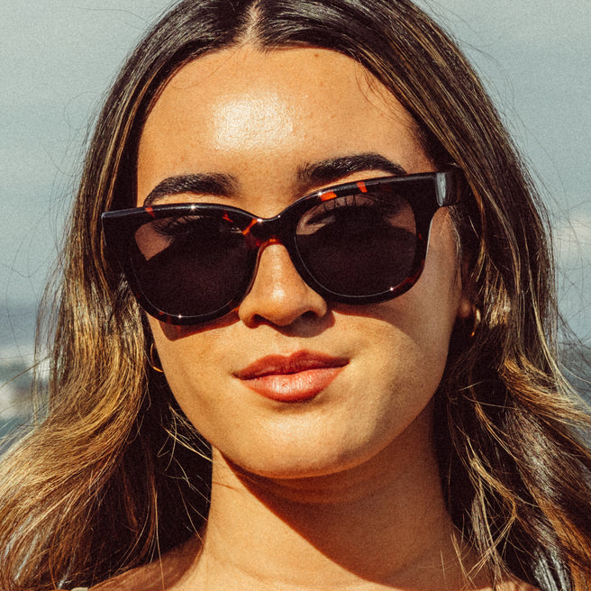 Woman wearing sunglasses with a blurred background