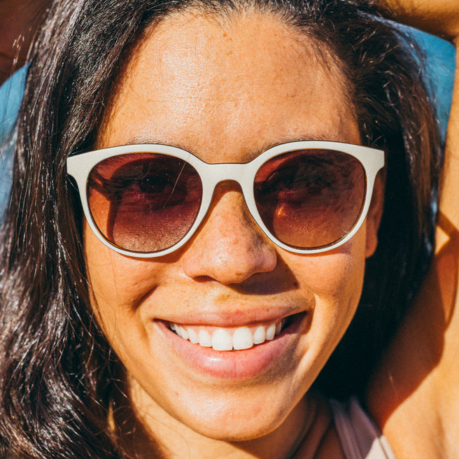 Woman wearing sunglasses with a blurred background