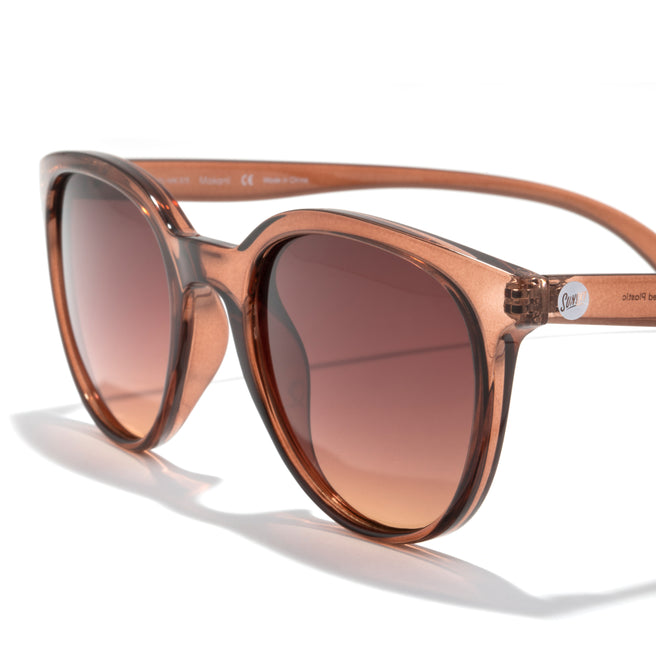 Brown sunglasses with gradient lenses on a white background