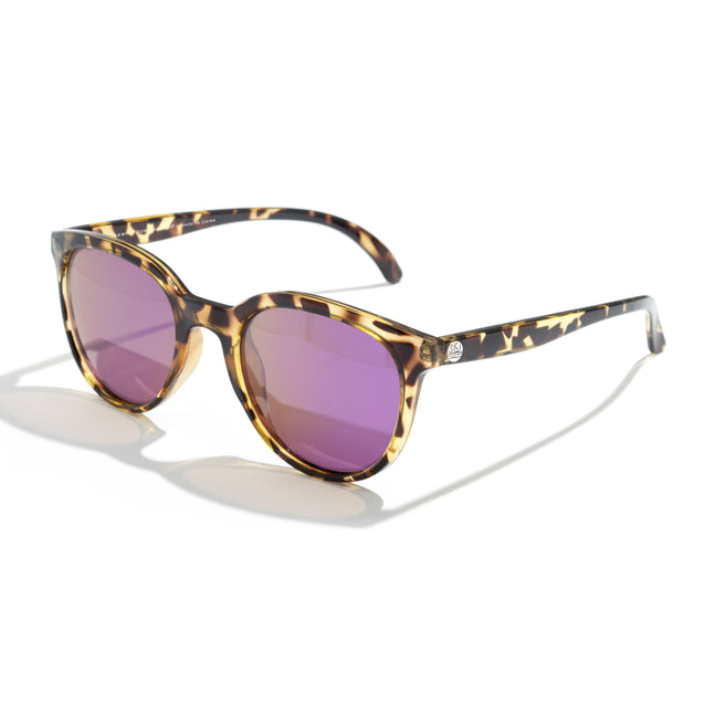 Sunglasses with tortoiseshell frame and pink lenses on a white background