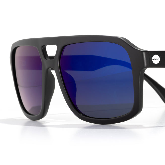 Black sunglasses with blue gradient lenses on a white background