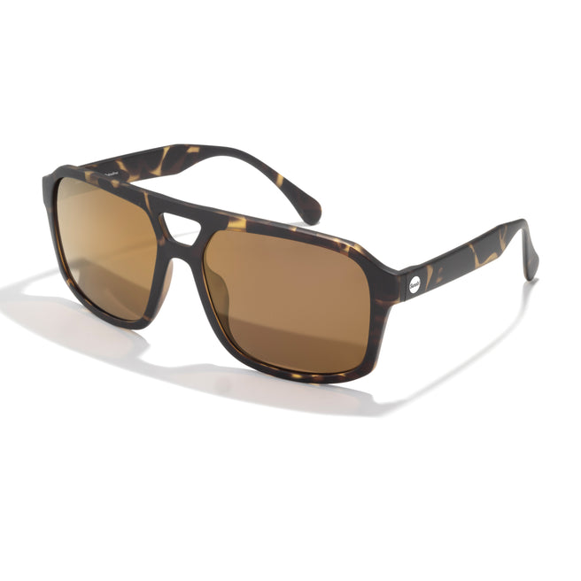 Sunglasses with tortoiseshell frame and brown lenses on a white background