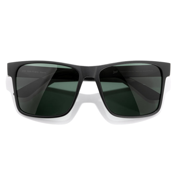 Puerto - Black Forest - Black sunglasses with dark lenses on a white background