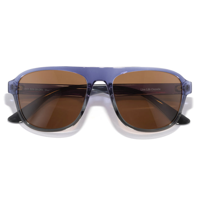 Sunglasses with brown lenses and a blue frame on a white background