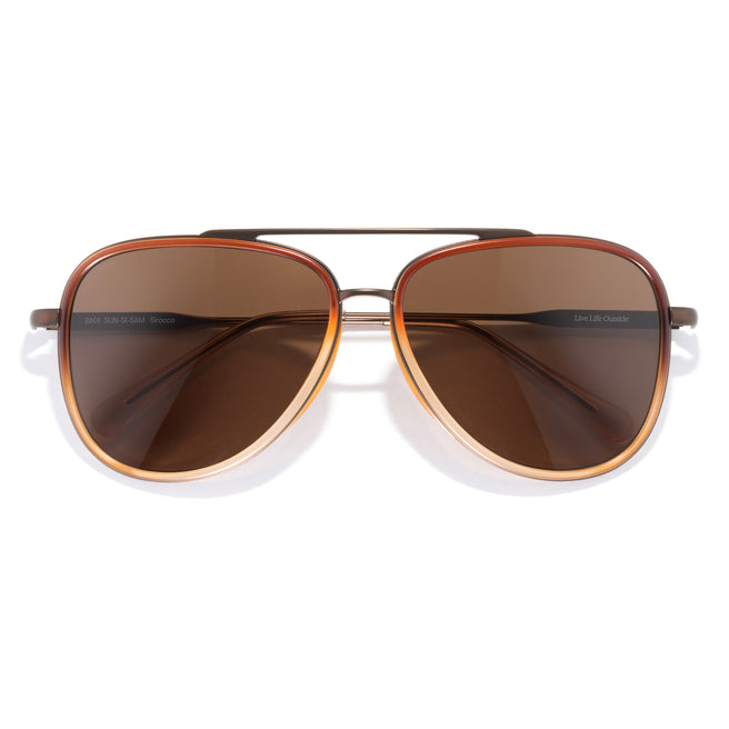 Aviator sunglasses with brown lenses on a white background