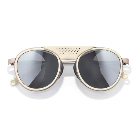 Strada - Ivory Silver - Sunglasses with gold frame and dark lenses on a white background