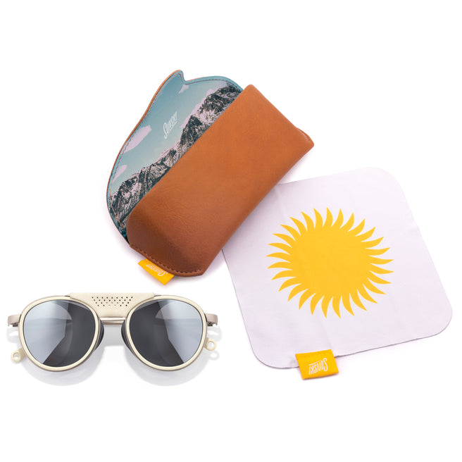 Sunglasses with a carrying hard case, and a microfiber cloth with a sun design.