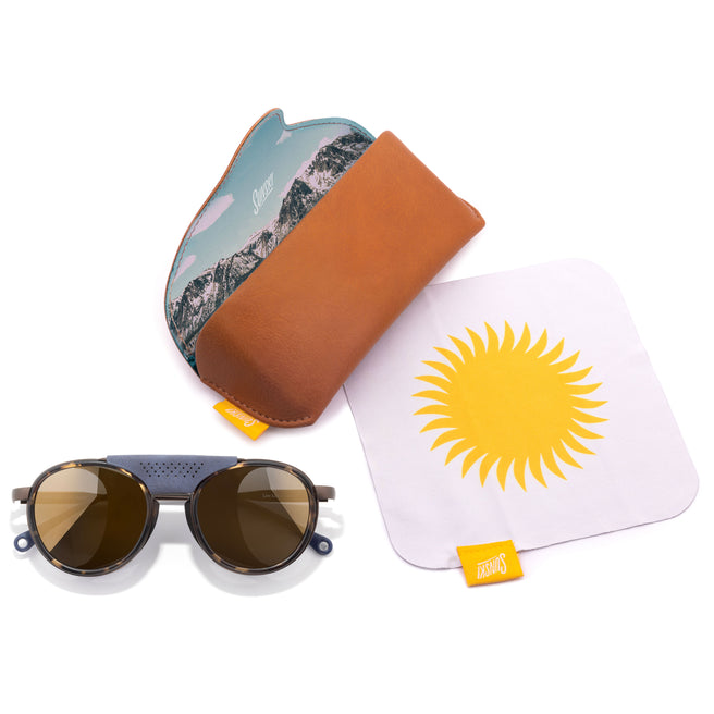 Sunglasses with a carrying hard case, and a microfiber cloth with a sun design.