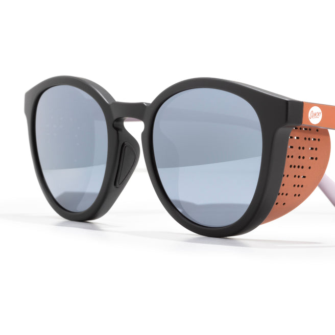 Sunglasses with black frame and blue lenses on a white background