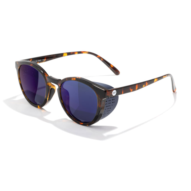Sunglasses with tortoiseshell frame and blue lenses on a white background