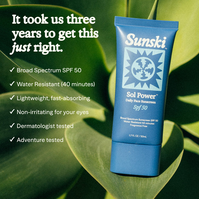 Sol Power SPF 50 Sunscreen - 1.7 Fl oz / 50 mL - Sunski Sol Power sunscreen tube on a leafy green background with product features listed.
