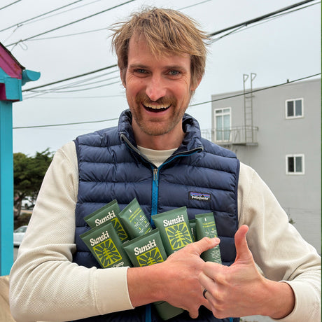 guy holding an armful of basecamp