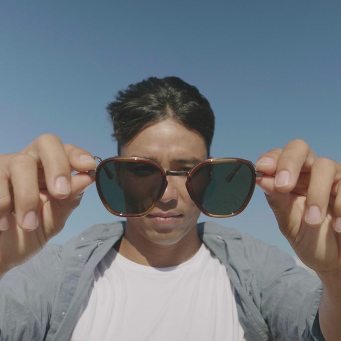guy trying on bernina sunglasses