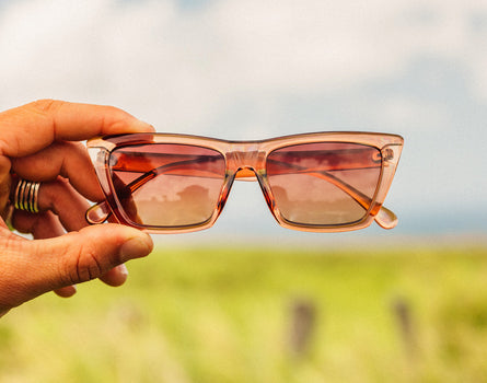 hand holding sunski fiorella sunglasses