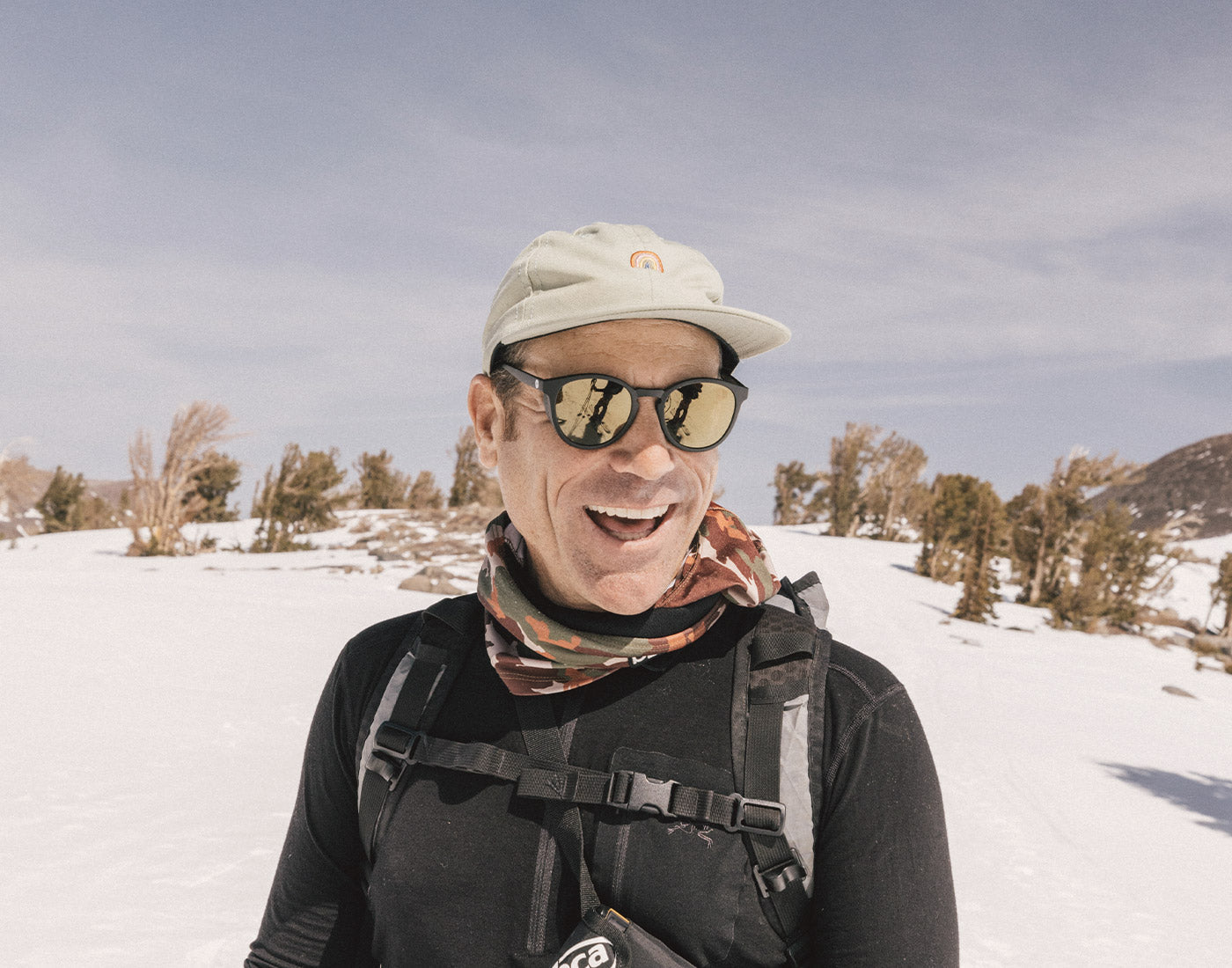 guy laughing wearing sunski tera sunglasses