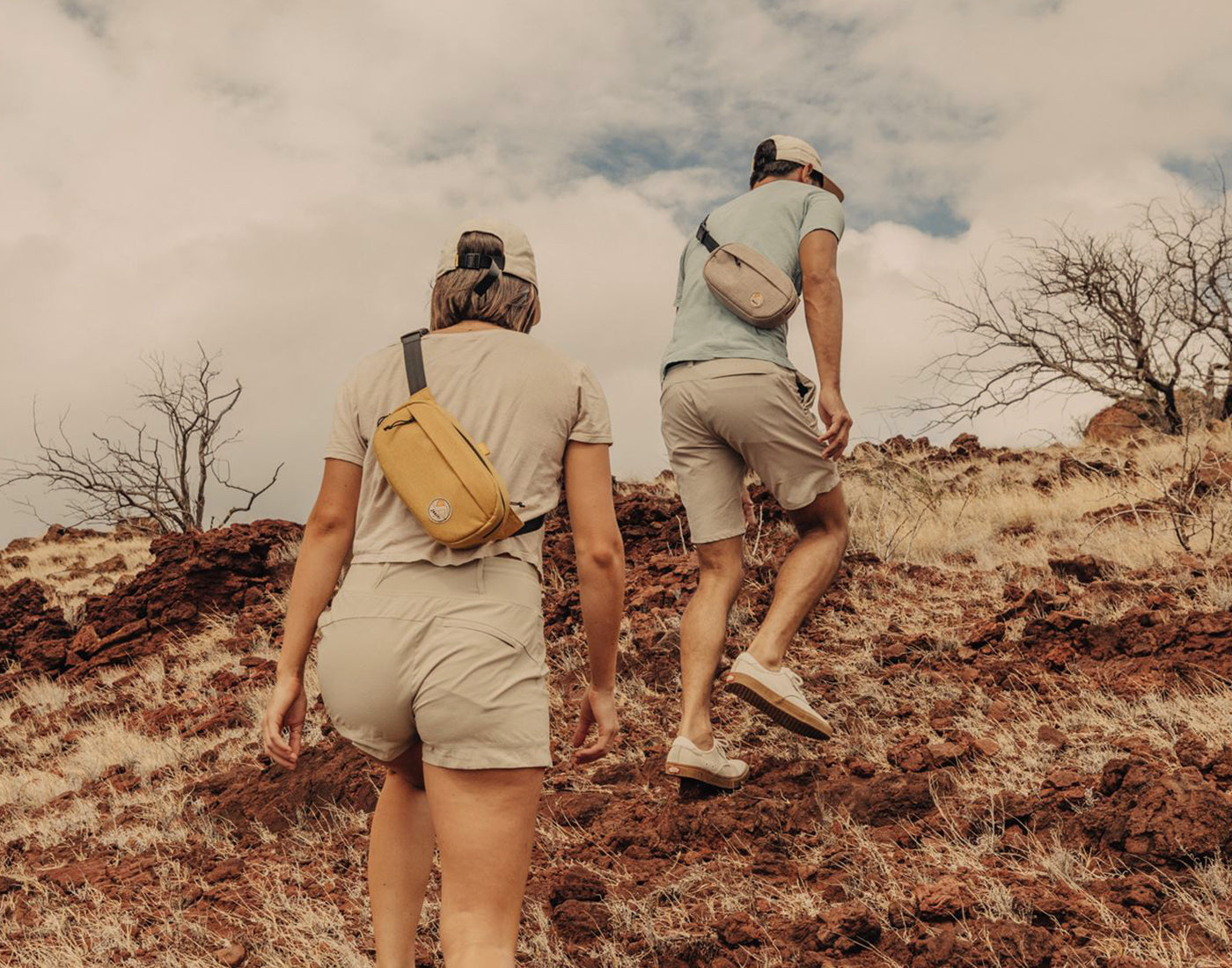 man and woman hiking wearing sunski sling