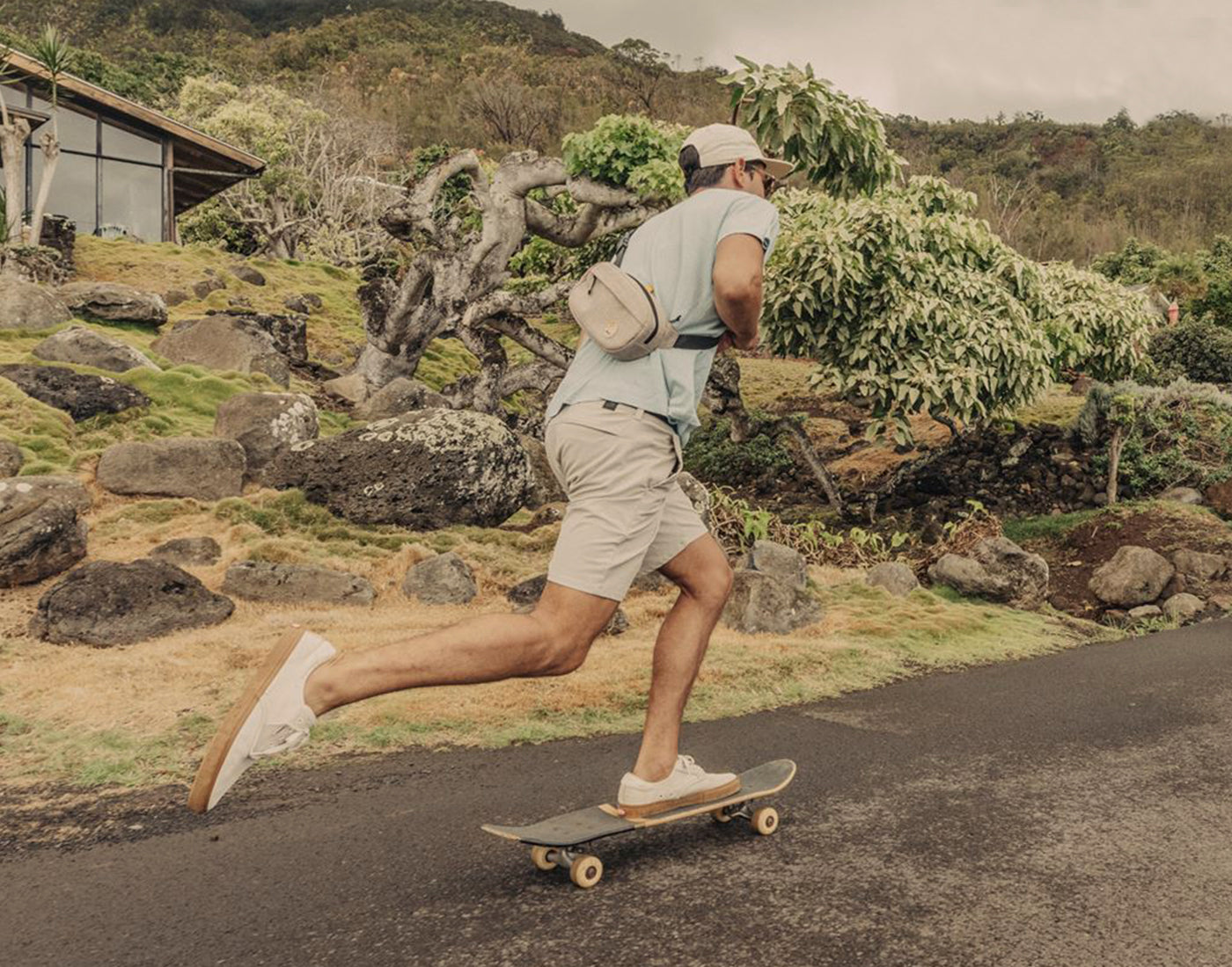 guy riding skateboard wearing sunski sling