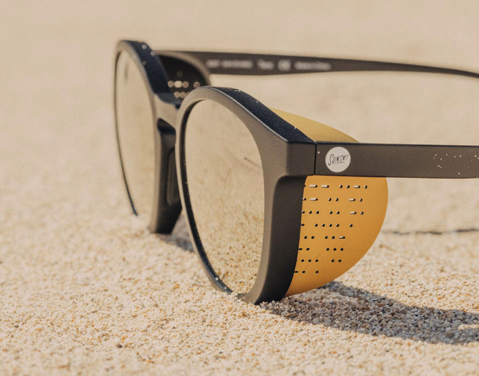 STORY sunski tera sun shields on a pair of sunski tera black gold sunglasses